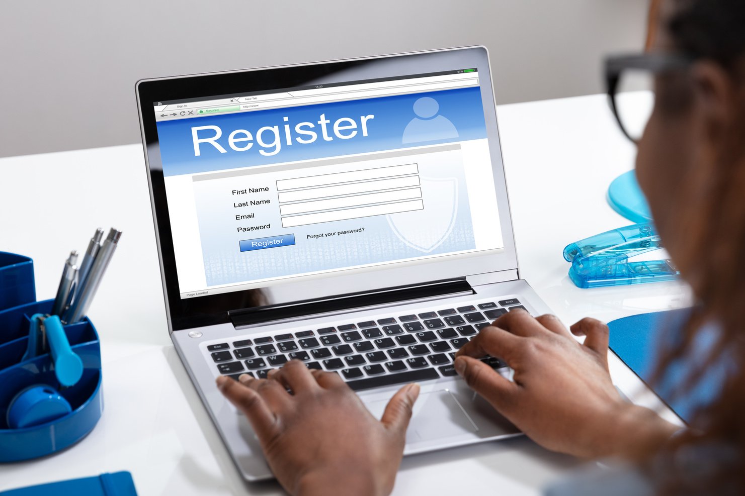 Woman Registering on a Laptop 